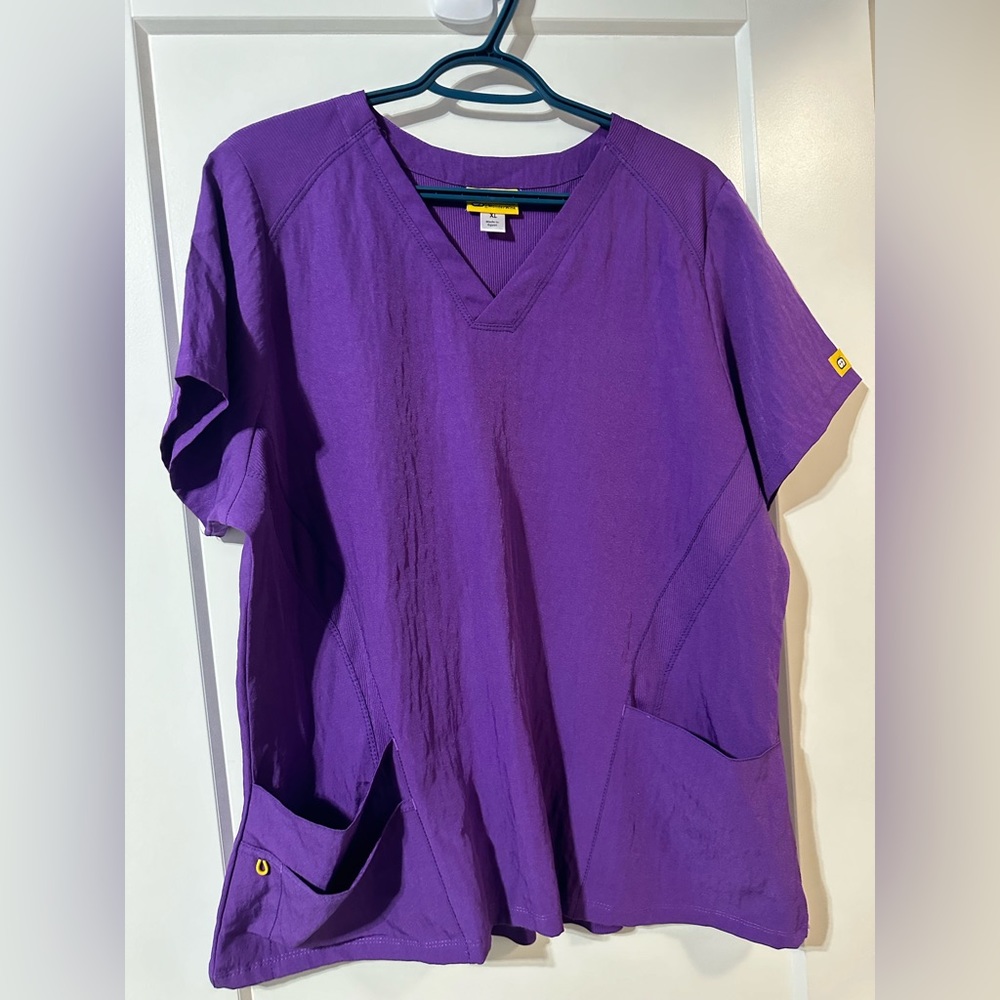 Vibrant purple like new Wonder Wink scrub top for healthcare workers nurses etc